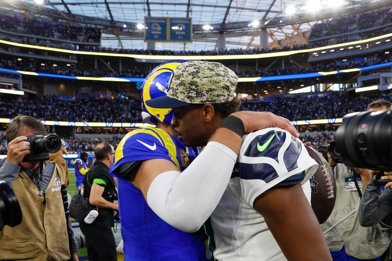 Seattle Seahawks quarterback Geno Smith (7) congratulates Los Angeles Rams quarterback Matthew Stafford (9) after a Rams victory during an NFL regular season game on November 19, 2023, at SoFi Stadium in Inglewood, CA.
