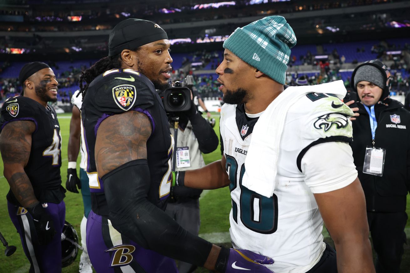 Derrick Henry #22 of the Baltimore Ravens greets Saquon Barkley #26 of the Philadelphia Eagles following the game at M&amp;T Bank Stadium on December 01, 2024 in Baltimore, Maryland.
