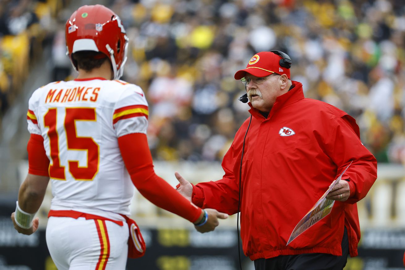 Head coach Andy Reid of the Kansas City Chiefs speaks with Patrick Mahomes #15 during the first quarter against the Pittsburgh Steelers at Acrisure Stadium on December 25, 2024 in Pittsburgh, Pennsylvania.