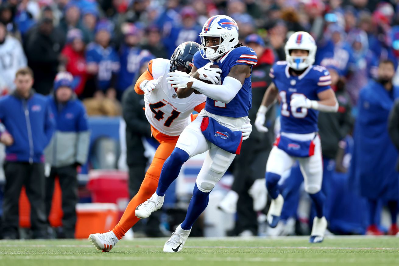 Curtis Samuel #1 of the Buffalo Bills carries the ball for a touchdown against the Denver Broncos in the fourth quarter during the AFC Wild Card Playoffs at Highmark Stadium on January 12, 2025 in Orchard Park, New York.