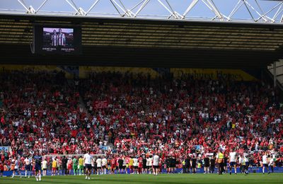 Liverpool players and staff acknowledge the fans as the LED board shows a tribute to former football player Diogo Jota and his brother Andre Silva who passed away on the 3rd of July 2025 following the pre-season friendly match between Preston North End and Liverpool at Deepdale on July 13, 2025 in Preston, England.